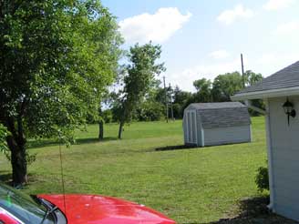 A picture of the yard to the South taken from the driveway