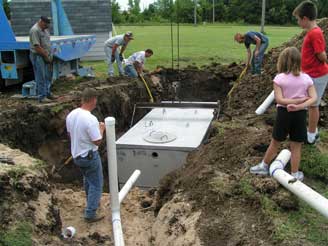 Putting the new tank in the ground.