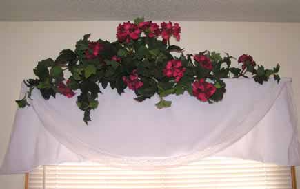 Iused a tablecloth with some flowers for a curtain lile window dressing