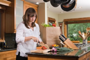 woman in kitchen save money in the kitchen