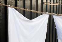 sheet-on-clothesline sheet hanging out to dry on clothesline
