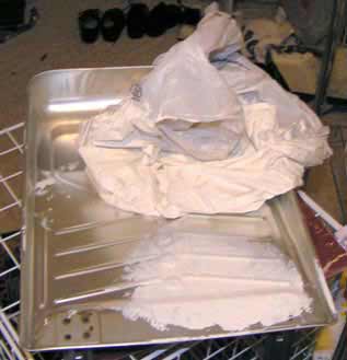 Invert the messy bag from the roller pan and throw it away