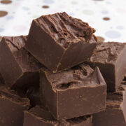 This 2 ingredient fudge recipe is one of our favorite Christmas candies! Who knew rich, creamy chocolate fudge could be so dreamy! Bring this to a family get-together or holiday party and they will think you worked all day perfecting it! Get this and 25 of the best easy Christmas candies all in one place!