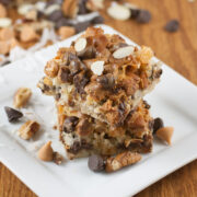 This easy 7 layer bar cookies recipe is rich and delicious! Made with graham cracker crumbs, chocolate, butterscotch, coconut and more, it is a super tasty treat perfect for the most die hard chocolate or cookie lover!