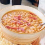 This bean and bacon soup recipe makes a hearty bean soup perfect for hungry families! It makes a great main dish, especially on weeknights when you don't feel like cooking. Serve with cornbread and biscuits for a perfect meal. It's easy to make with about 5 minutes prep time and then simmer.
