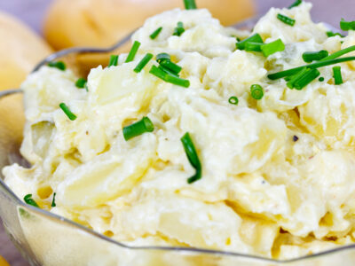 This is the best homemade potato salad recipe EVER!! People beg me for this at potlucks and barbecues because of my secret ingredient! It's quick and easy to make and makes a nice addition to picnics, potlucks and family get togethers!