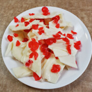 This tasty cherry bark Christmas candy recipe makes an easy 2 ingredient candy with the taste of cherries and white chocolate. It's perfect for holiday parties and get togethers. Find this recipe and 25 of the best easy Christmas candy recipes including peppermint bark and lemon bark here!