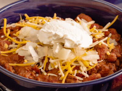 This sour cream chili bake recipe makes a quick and easy tasty chili you can toss in the crockpot on busy days. The entire family loves it!