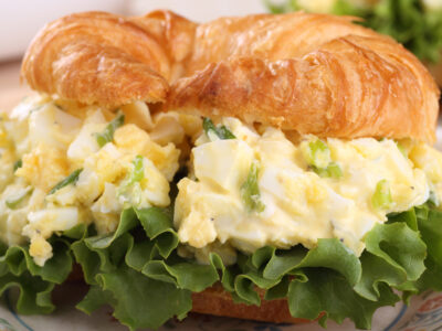 This easy egg salad recipe makes a tasty traditional egg salad you can throw together in 5 minutes. It's perfect for egg salad sandwiches and to top salads. You can make a week's worth and have an easy lunch all week! You'll also find a fancier version if you want something a little different!