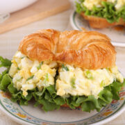 This easy egg salad recipe makes a tasty traditional egg salad you can throw together in 5 minutes. It's perfect for egg salad sandwiches and to top salads. You can make a week's worth and have an easy lunch all week! You'll also find a fancier version if you want something a little different!