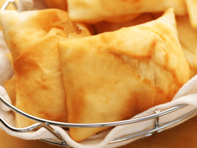 This easy sopapilla recipe makes a delightful treat with a crispy golden exterior and a soft, airy interior that practically melts in your mouth. Whether served as a sweet snack or a dessert, these traditional Mexican fried pastries are irresistibly delicious and easy to enjoy with every bite!