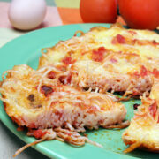 This easy spaghetti pizza recipe is a great way to use leftover spaghetti. It makes an easy spaghetti casserole using any pizza-type leftovers and other pizza ingredients you love!