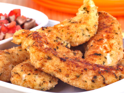 This easy garlic chicken recipe makes a delicious Italian themed garlic parmesan chicken. It is a perfect dinner recipe and one of our favorite chicken breast recipes. It's very versatile, but to make it easy, I serve it with rice and a vegetable like broccoli or Italian green beans.