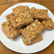 If you love Payday candy bars, you're going to want to try these 4 Ingredient Homemade Payday Bars! Packed with salty peanuts, gooey caramel, creamy peanut butter, and fluffy marshmallows, they're an easy no-bake treat that's hard to stop eating.