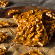 This easy peanut brittle recipe is one of my top 2 favorite Christmas candies! I love the peanutty, salty-sweet flavor and especially the crunchy texture! You will want to make it every year! Find this and 25 of the best easy Christmas candies here!