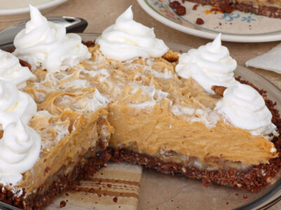 This easy no bake peanut butter pie recipe makes a cool and tasty pie. Our kids absolutely love it! The creamy and smooth peanut butter and cream cheese filling go perfectly with the Oreo chocolate crust! It's great for dessert anytime or for holiday get togethers!